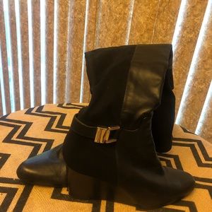 Black leather wedge style tall women’s boots
